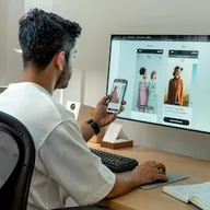 Post thumbnail: a person at a desk browsing clothing on a phone